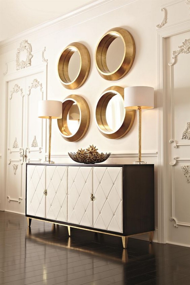 JET SET BUFFET BY BERNHARDT - Buffet with stripe sapele veneers and caviar finish with gold finish base. It has four wrapped doord quilted in white bonded leather with nailhead.