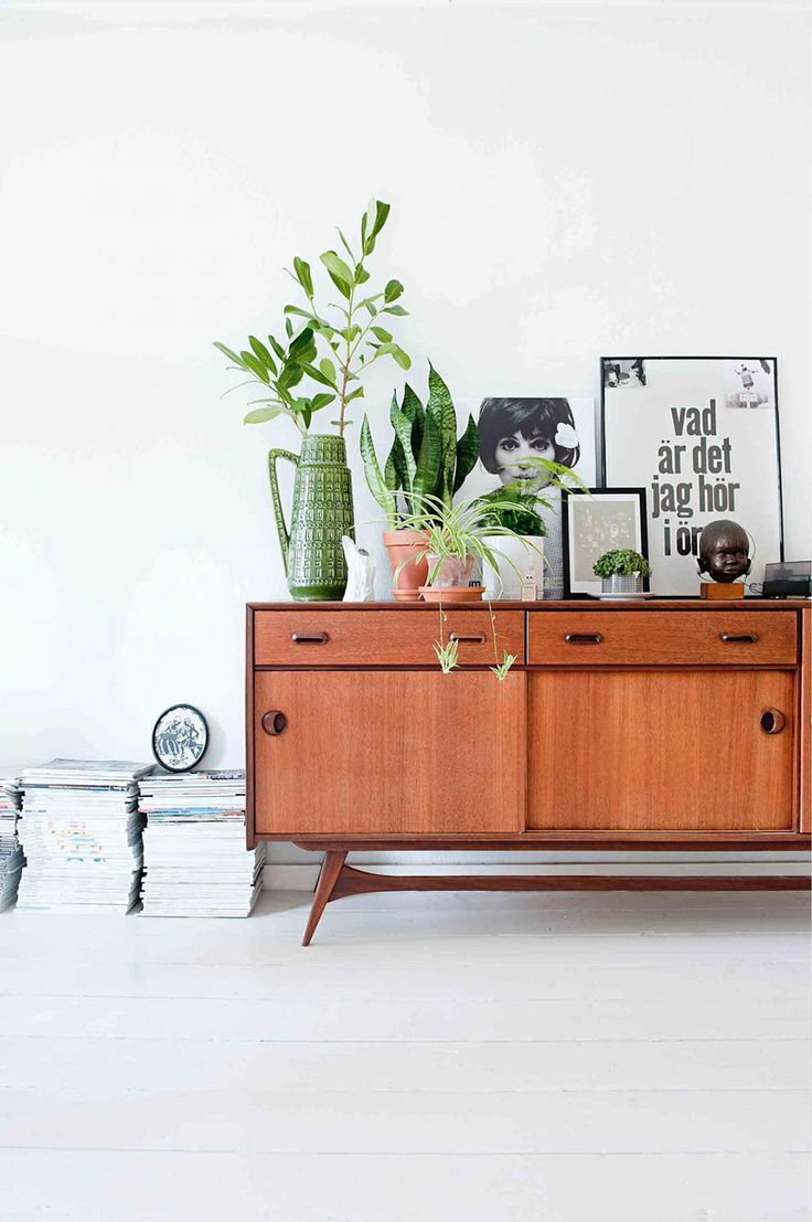 PLANT STAND - Hipster plant lovers unite for the most perfect plant stand. Yes. Simply gather those leafy greens together on a mid-century credenza and you’ve got the looks for that California eclectic home.